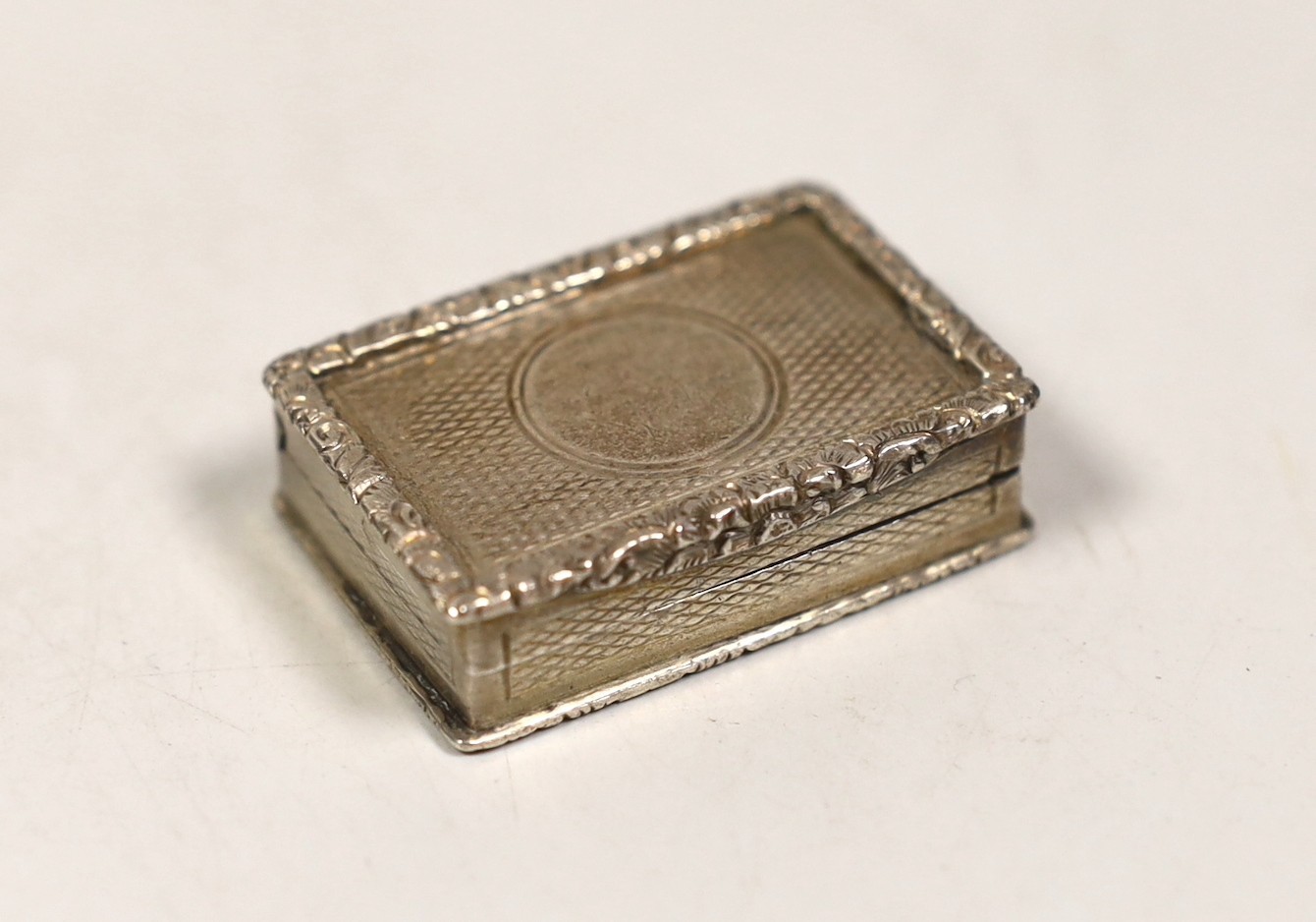 A late Victorian engine turned silver rectangular vinaigrette, George Unite, Birmingham, 1898, 41mm.